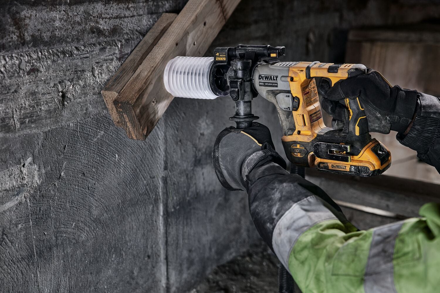Atomic 20 volt five eighths inch brushless cordless S D S plus rotary hammer tool being used to hammer wood.